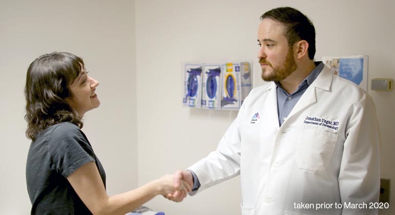 Image of doctor shaking hands with patient